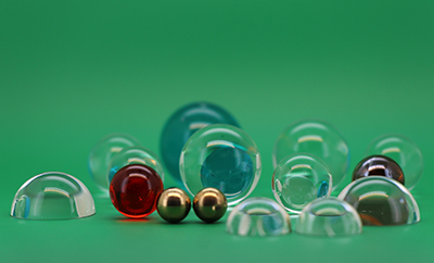 Ball and Half Ball Lenses: Design and Application of Miniature Optical Elements